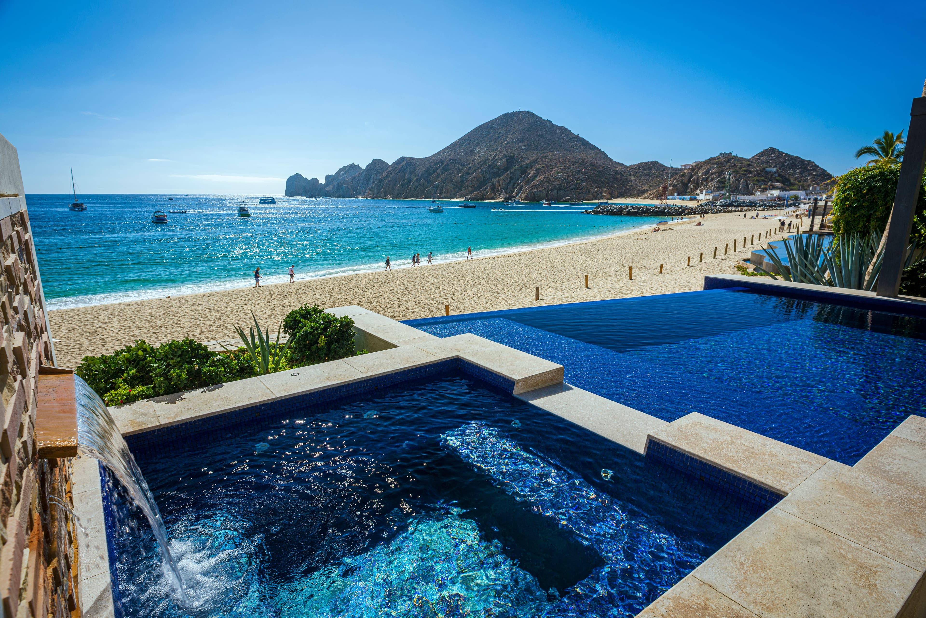 Private infinity pool with panoramic views of the iconic Cabo San Lucas Arch. This stunning beachfront property sits steps from the most pop